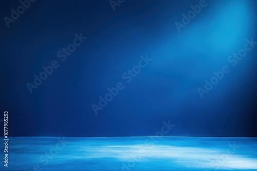 Blue studio background with spotlight.