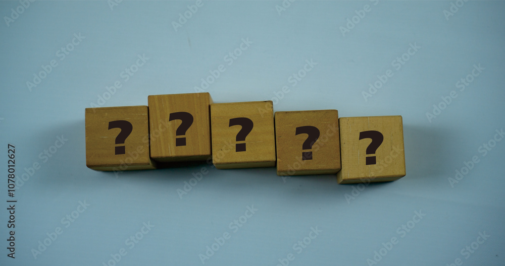 Questioned Marks Symbol Concept on wooden blocks. Idea for healthcare, typography, medical, business and financial concept. Copy space for mockup, marketing and background Questioned Marks Symbol Concept on wooden blocks. Idea for healthcare, typography, medical, business and financial concept. Copy space for mockup, marketing and background