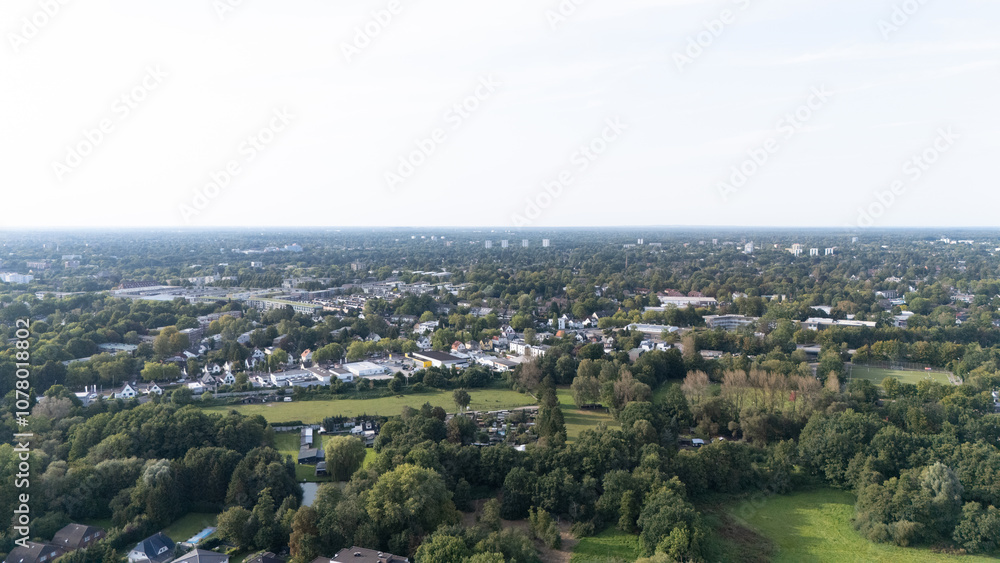 Naklejka premium Aerial View of a Lush Green Suburban Townscape