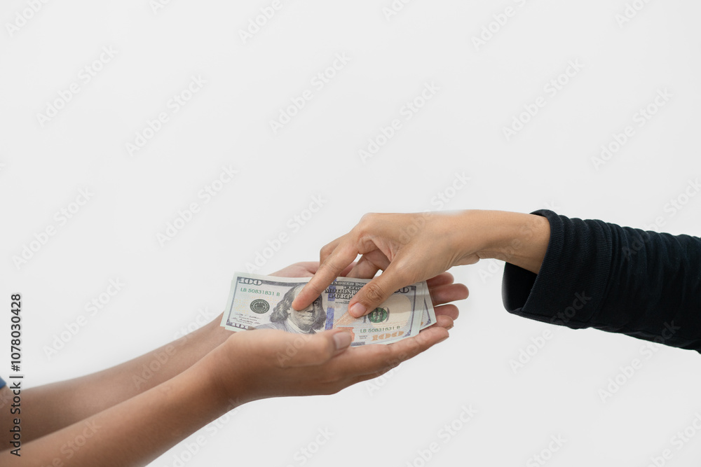 woman's hand giving dollar bill to man's hand, isolated on white background. woman's hand giving dollar bill to man's hand, isolated on white background.