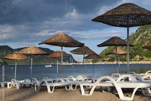 Obraz na płótnie Sunbeds and umbrellas on the beach of Icmeler. Marmaris