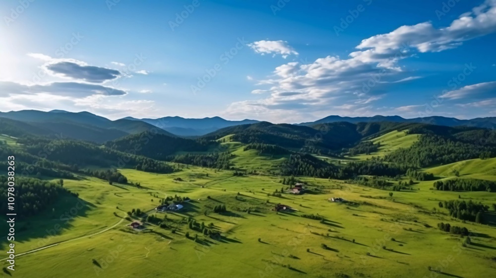 Fototapeta premium Aerial view of lush green hills and valleys under a bright blue sky with scattered clouds.