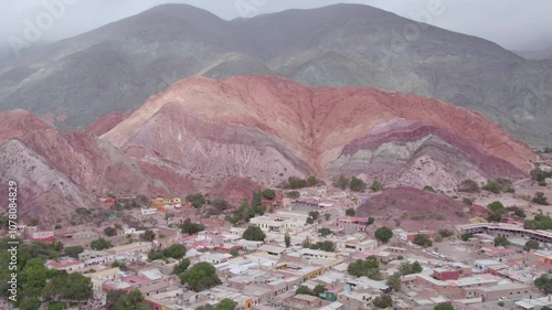 Aerial footage of the Montana siete colores and Cerro de los Siete Colores in Purmamarca, Argentina photo