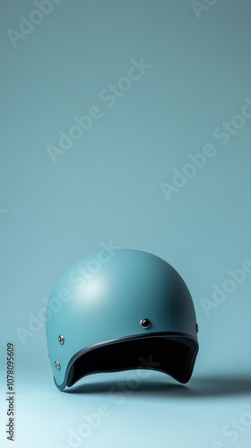 The sleek helmet mockup features a clean design showcased on a light blue backdrop photo