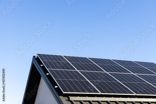 Wallpaper Mural Modern house with solar panels stand-alone photovoltaic plant system on household metal sheet rooftop. Clear blue sky background. Clean alternative energy concept. Professional installation, go green Torontodigital.ca