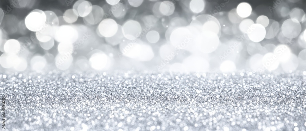 A silver background with a lot of glitter A silver background with a lot of glitter
