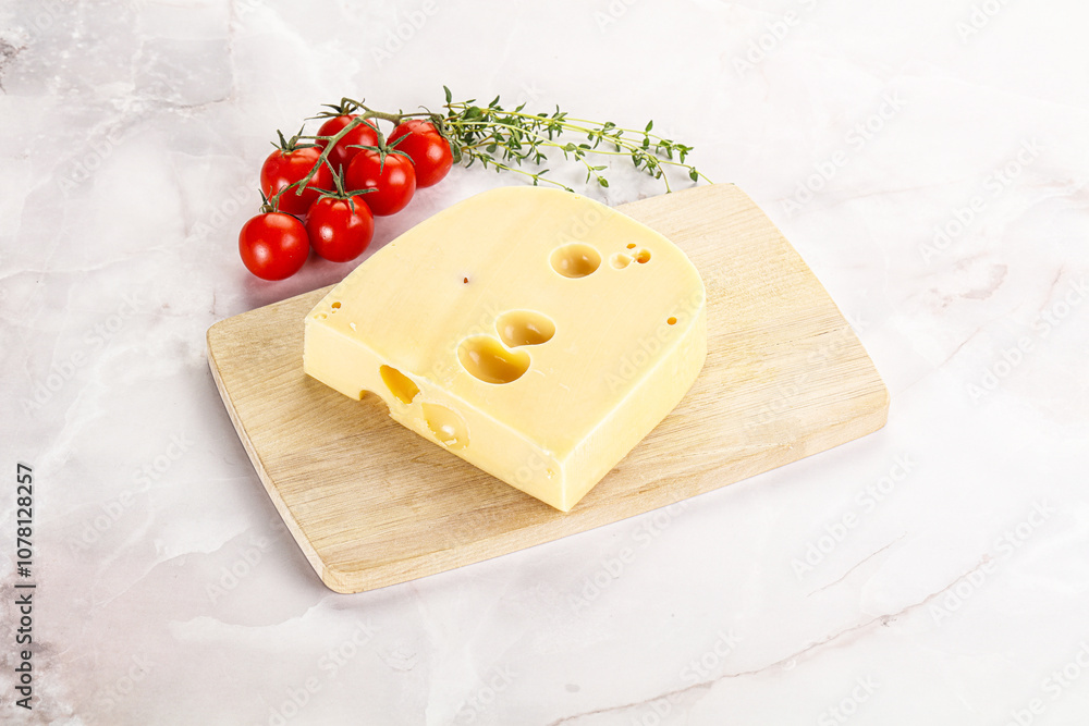 Maasdam cheese brick over board Maasdam cheese brick over board