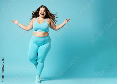 Portrait of a curvaceous plus-size girl in sportswear