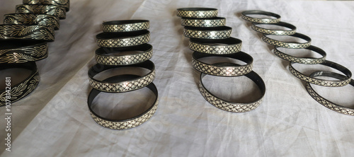 A Collection of Bangles made up of Copper-Zinc metal and inlaid with Silver known as 'Bidriware' art in Bidar town in India. photo