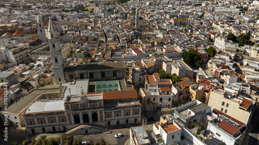 Fototapeta premium Aerial view of the church of San Francesco, with its high bell tower, and the city hall of Andria, in Puglia, Italy
