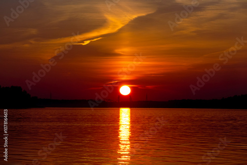 Golden sunset on the beach at neva river in saint-petersburg, russia. Tranquil scene. Nature background. Landscape. High quality photo