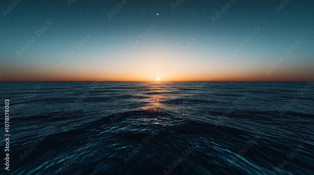 Vibrant sunrise over a calm ocean with reflections on water surface under a clear sky, creating a serene and peaceful seascape backdrop.