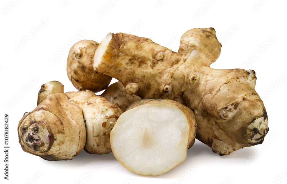 Jerusalem artichoke and a piece on a white background. Isolated Jerusalem artichoke and a piece on a white background. Isolated