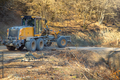 Bulldozer on old unpaved highway. photo