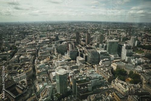 Aerial view of London cityscape with modern skyscrapers and historical buildings.