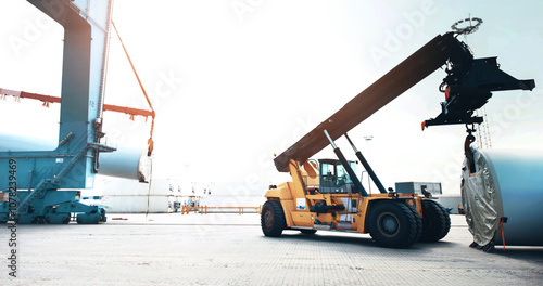 Shipping, container and reach stacker for logistics, transport or lift storage tank. Machine, handler and vehicle at port with heavy equipment for cargo, supply chain or crane for industrial freight