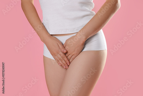 Wallpaper Mural STD (sexually transmitted disease). Woman suffering from symptoms on pink background, closeup Torontodigital.ca