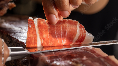 Bild auf Leinwand Chef cutting spanish ham Jamon iberico