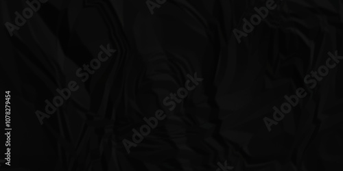 Crumpled paper texture. Black wrinkled paper texture. Black paper texture . Black crumpled and top view textures can be used for background of text or any contents .