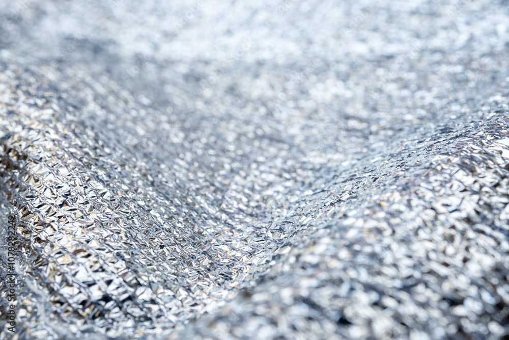 Background from shiny fabric with narrow focus Background from shiny fabric with narrow focus