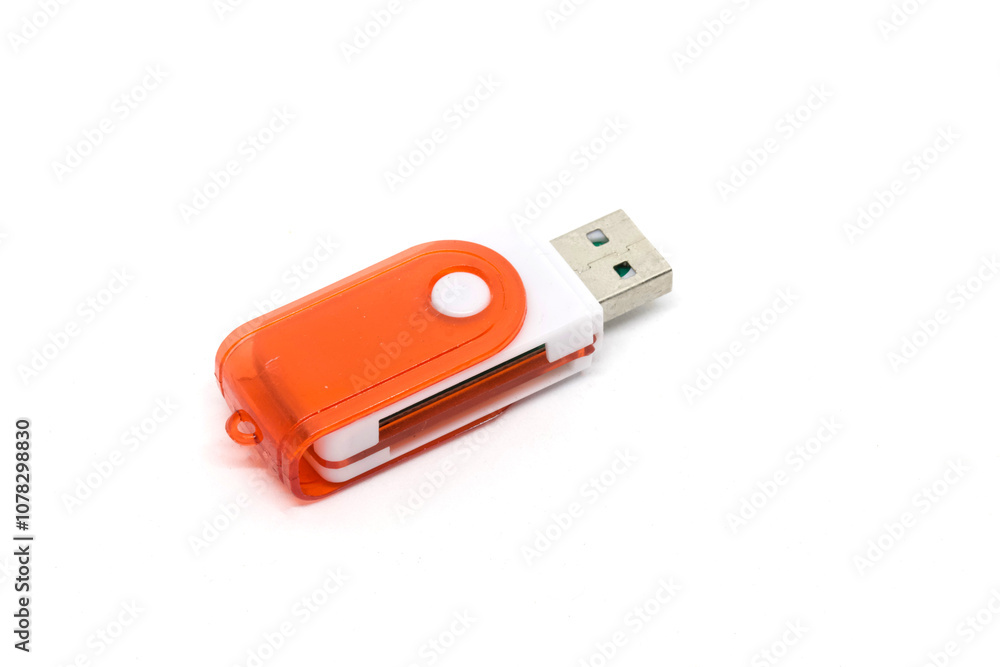 Close-up of an orange USB flash drive on a white background, ideal for data storage, file transfer, and portable media applications. Close-up of an orange USB flash drive on a white background, ideal for data storage, file transfer, and portable media applications.