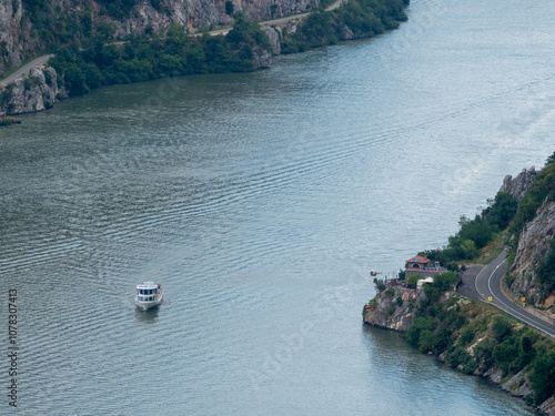 Tourist boat on Cazanele Mici gorge at Danube river, Romania