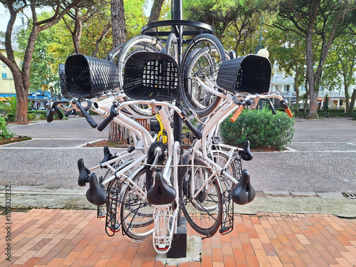 Vertical hanging bicycle parking on a city street.