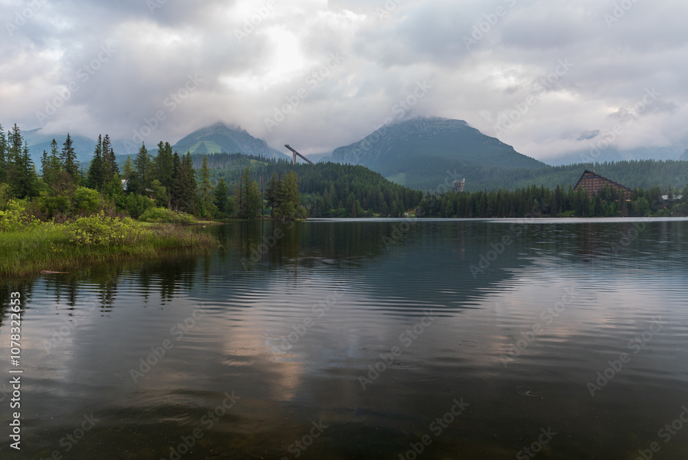 Cloudy summer morning on Strbske pleso in High Tatras mountains