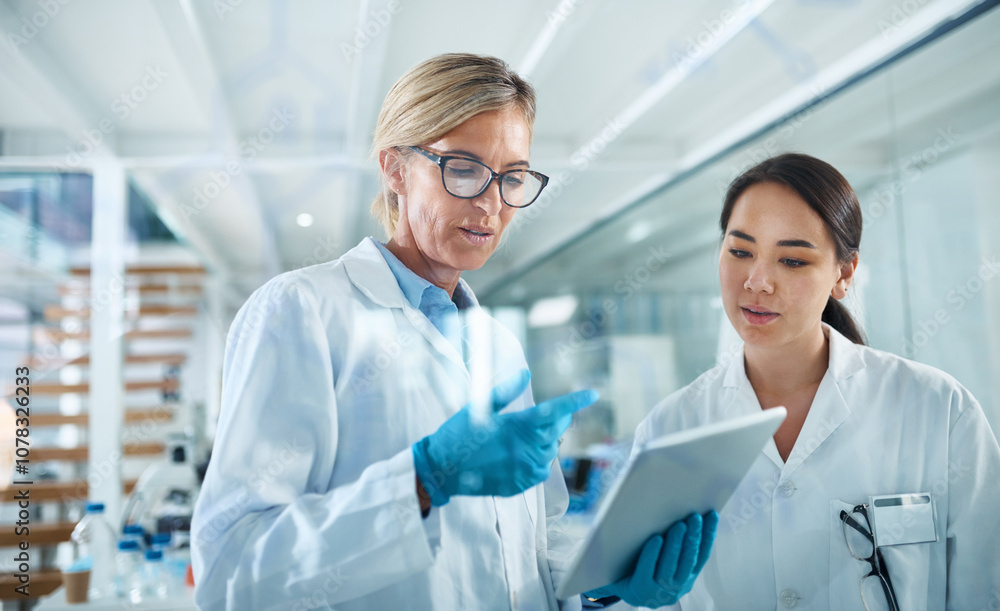 Women, scientist and discussion in lab with tablet, reading and review for experiment results at pharma company. People, mentor and feedback with solution, stats or medical research for mpox vaccine Women, scientist and discussion in lab with tablet, reading and review for experiment results at pharma company. People, mentor and feedback with solution, stats or medical research for mpox vaccine