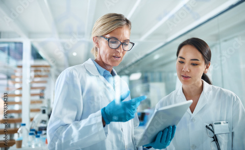 Women, scientist and discussion in lab with tablet, reading and review for experiment results at pharma company. People, mentor and feedback with solution, stats or medical research for mpox vaccine