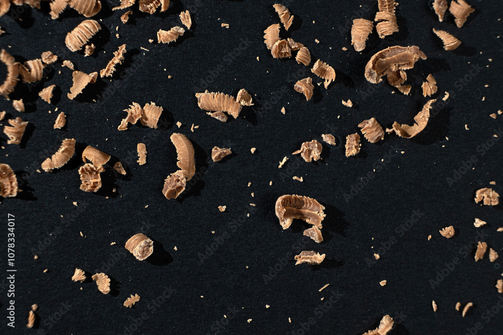 Grated natural organic chocolate shavings on a black background Grated natural organic chocolate shavings on a black background