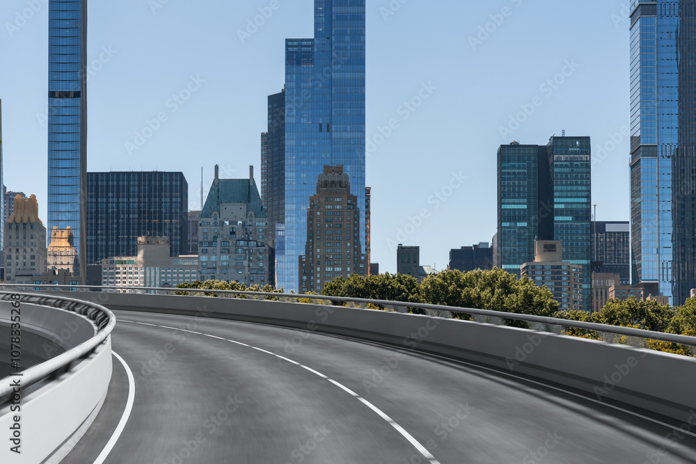 Curved road with modern skyscrapers in New York City skyline in the background. Curved road with modern skyscrapers in New York City skyline in the background.