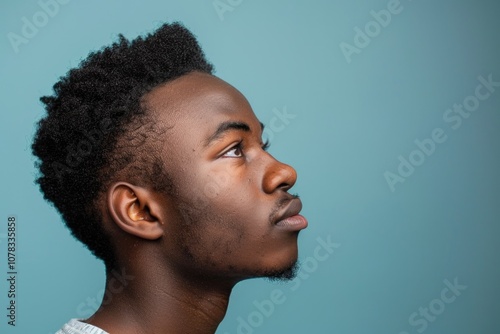 Man Side Portrait of Attractive African American Adult with Afro Hairstyle on Blank Background