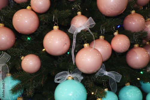 Shiny pink balls and turquoise on the Christmas tree.             