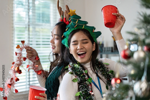 Festive Celebration with Friend Wearing Christmas Accessories and Enjoying Holiday Cheer