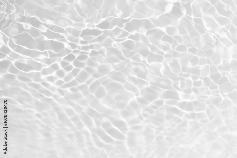 White water with ripples on the surface. Defocus blurred transparent white colored clear calm water surface texture with splashes and bubbles. Water waves with shining pattern texture background. White water with ripples on the surface. Defocus blurred transparent white colored clear calm water surface texture with splashes and bubbles. Water waves with shining pattern texture background.
