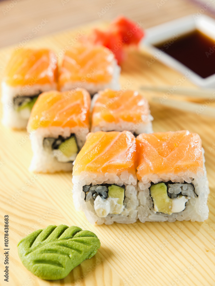 A plate of sushi with a wasabi on it A plate of sushi with a wasabi on it