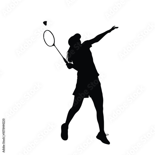 A woman is playing badminton and holding a racket. She is in the air and has a racket in her hand