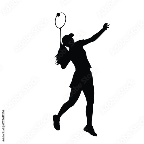 A woman is playing badminton and holding a racket. She is in the air and has a racket in her hand