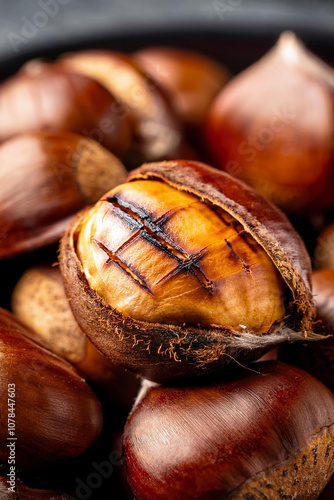 Edible sweet chestnuts with roasted chestnut. Great food background for your progects. photo