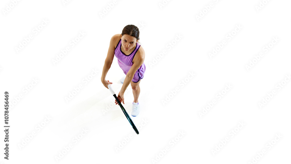 Tennis player braces for strong serve, holding her racket with precision against white studio background, ready to take on next move with full energy.. Concept of professional sport, championship. Ad Tennis player braces for strong serve, holding her racket with precision against white studio background, ready to take on next move with full energy.. Concept of professional sport, championship. Ad