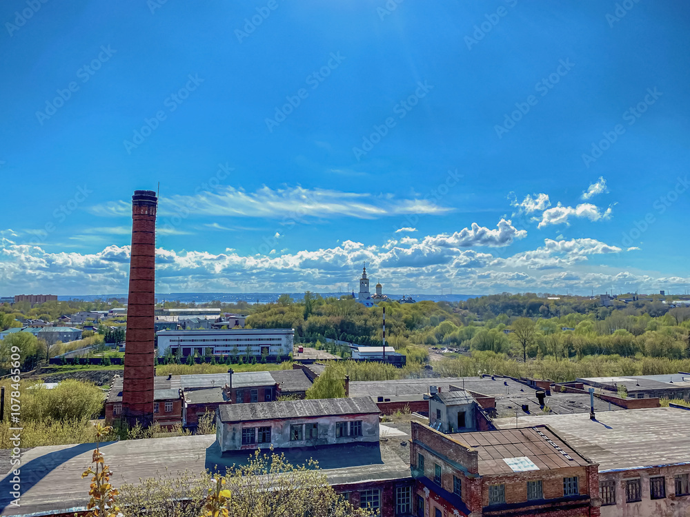 Aerial view of the old abandoned factory on a background of blue sky. Aerial view of the old abandoned factory on a background of blue sky.