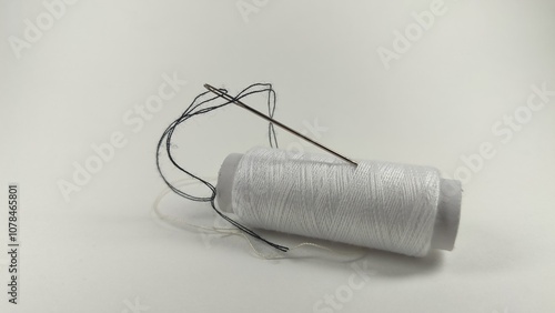 The photo shows threads and needles. Sewing clothes. photo