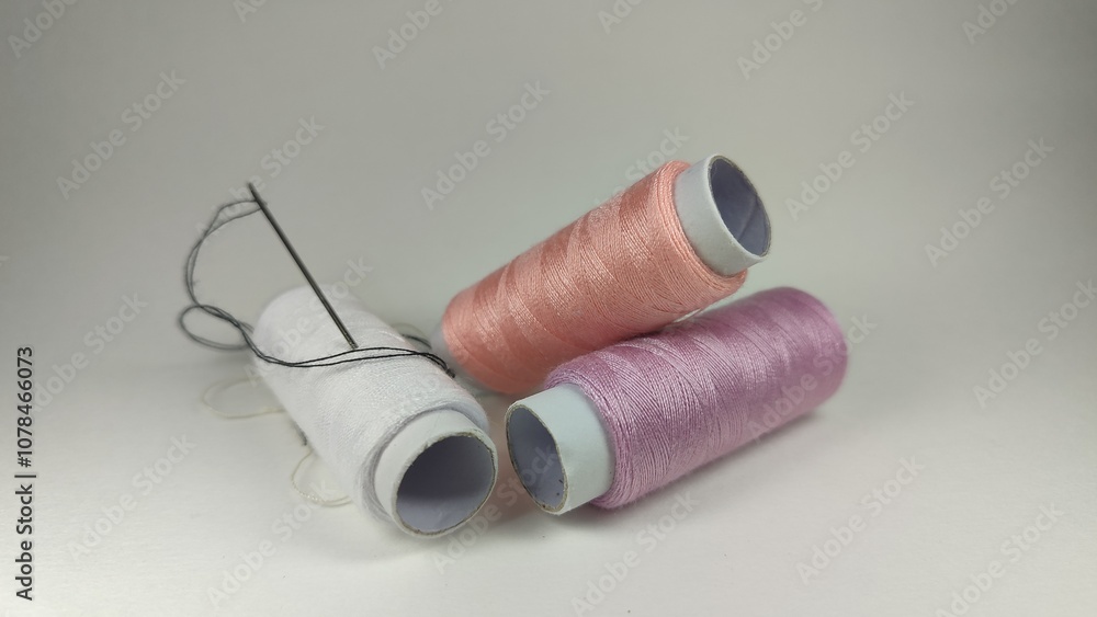 The photo shows threads and needles. Sewing clothes. The photo shows threads and needles. Sewing clothes.