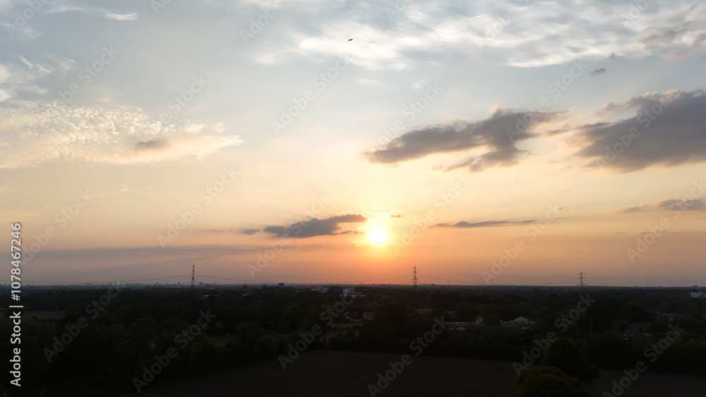 Fototapeta premium Breathtaking Sunset Over Peaceful Countryside Landscape
