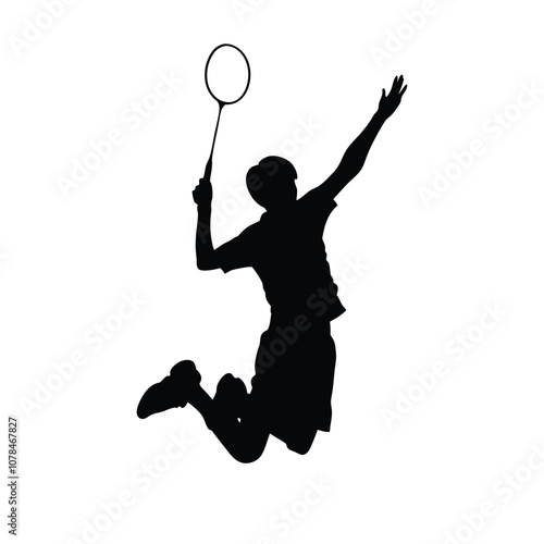 A man is playing badminton and jumping in the air. He is holding a racket. The racket is black and white