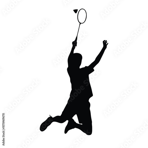 A man is playing badminton and jumping in the air. He is holding a racket. The racket is black and white