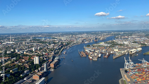 Aerial View of Cityscape with River and Shipping Port