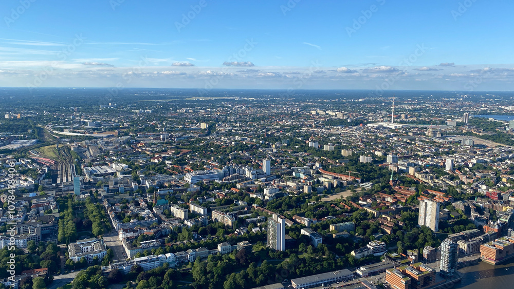 Aerial View of Urban Cityscape with Greenery and Blue Sky Aerial View of Urban Cityscape with Greenery and Blue Sky