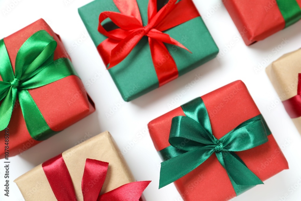 Beautiful gift box tied with golden bow on color background Beautiful gift box tied with golden bow on color background